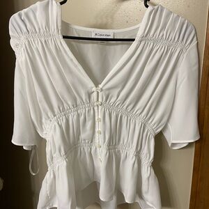 Very cute white Calvin Klein women’s top.